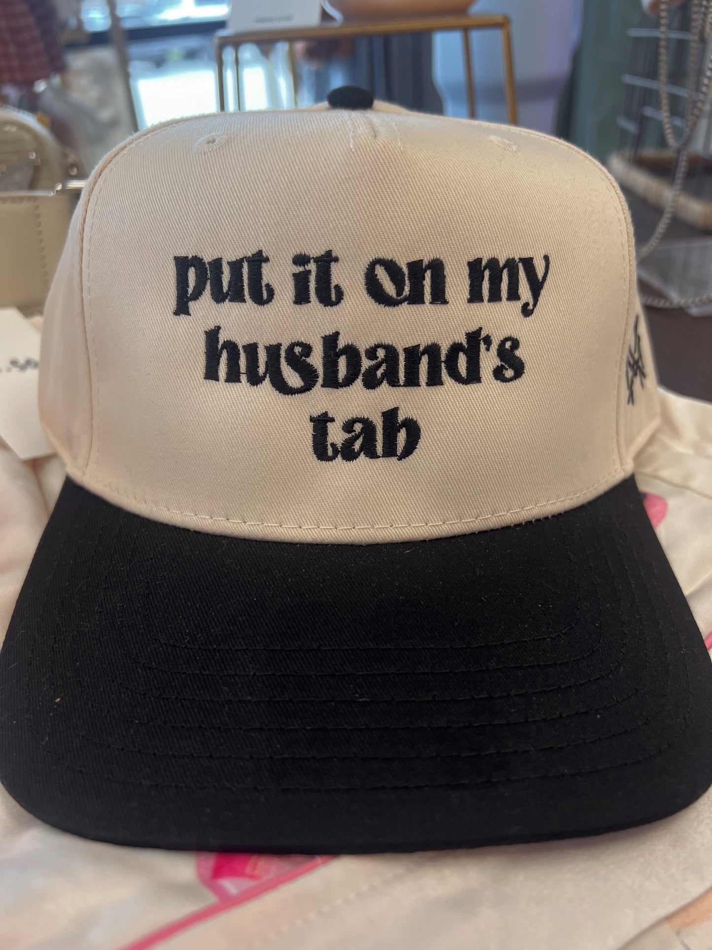 Put It On My Husband’s Tab Trucker Hat